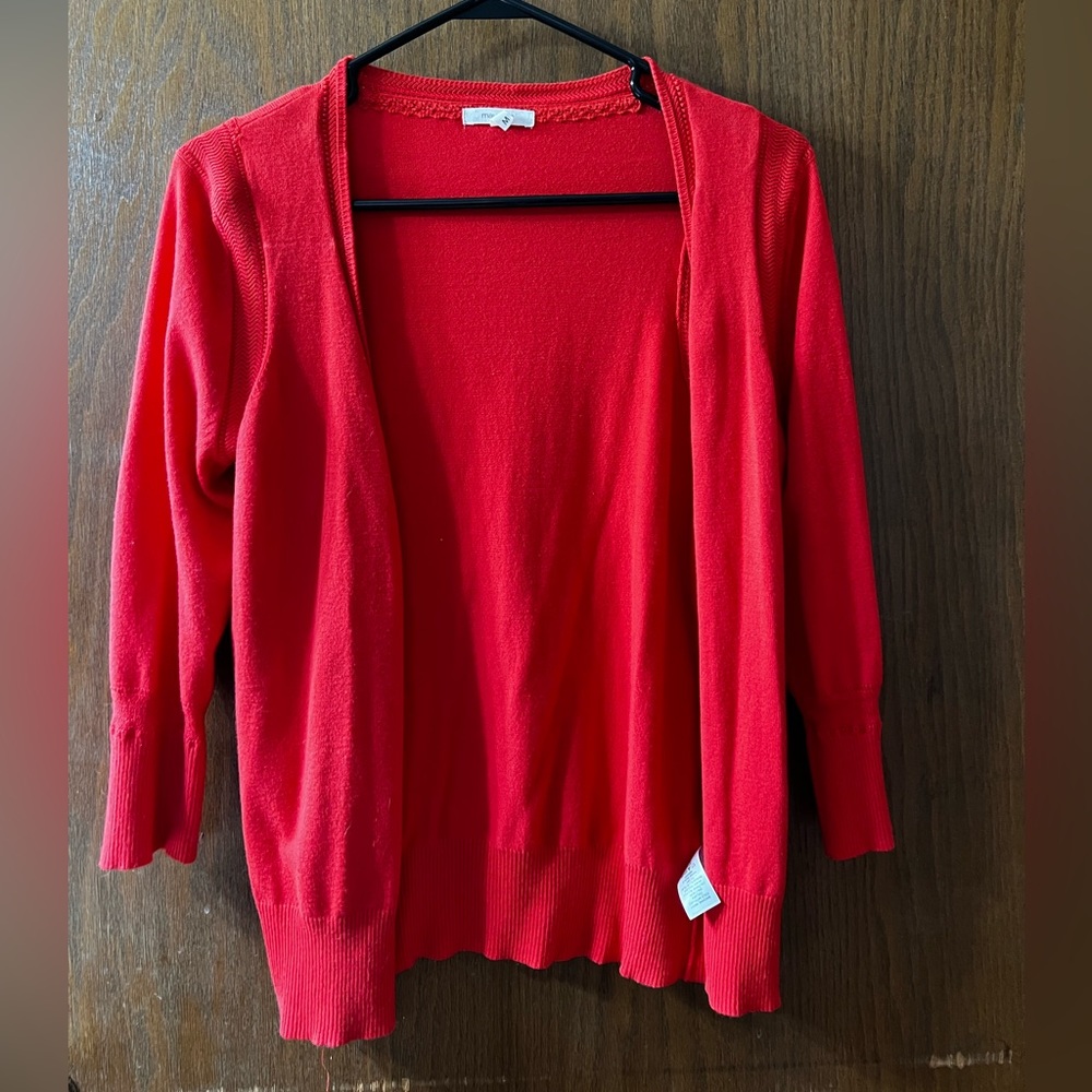Maurice’s 3/4 sleeve salmon colored sweater. Size medium. Worn once.